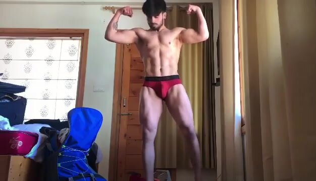 Sexy Indian man flexing in briefs