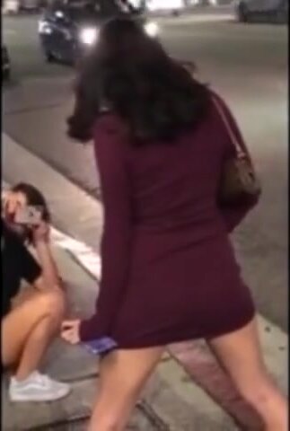 Drunk girls pissing on the street