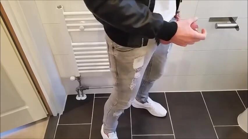 Cock out of jeans - cums on bathroom floor