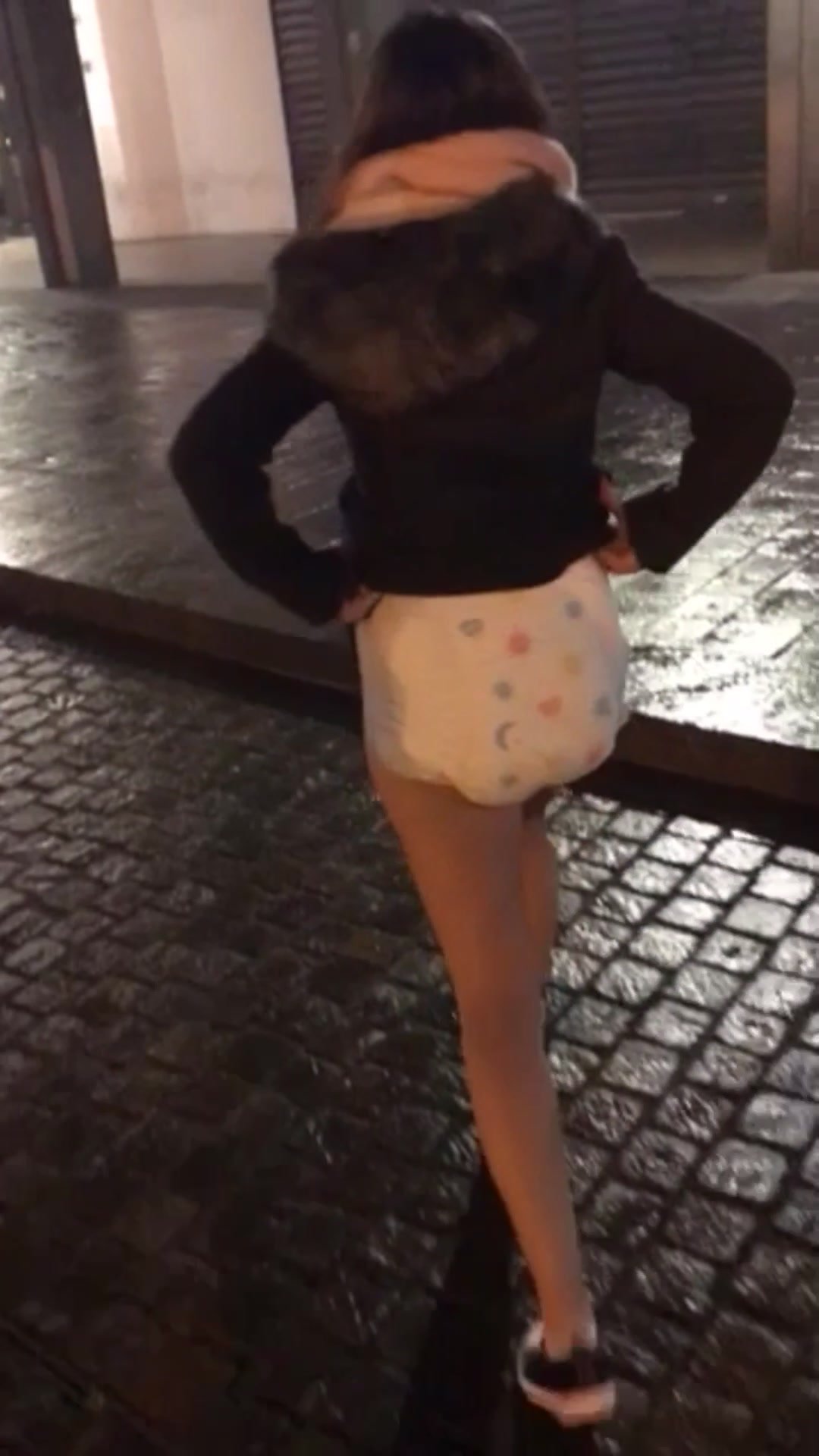 Girl shows her diaper in public at night