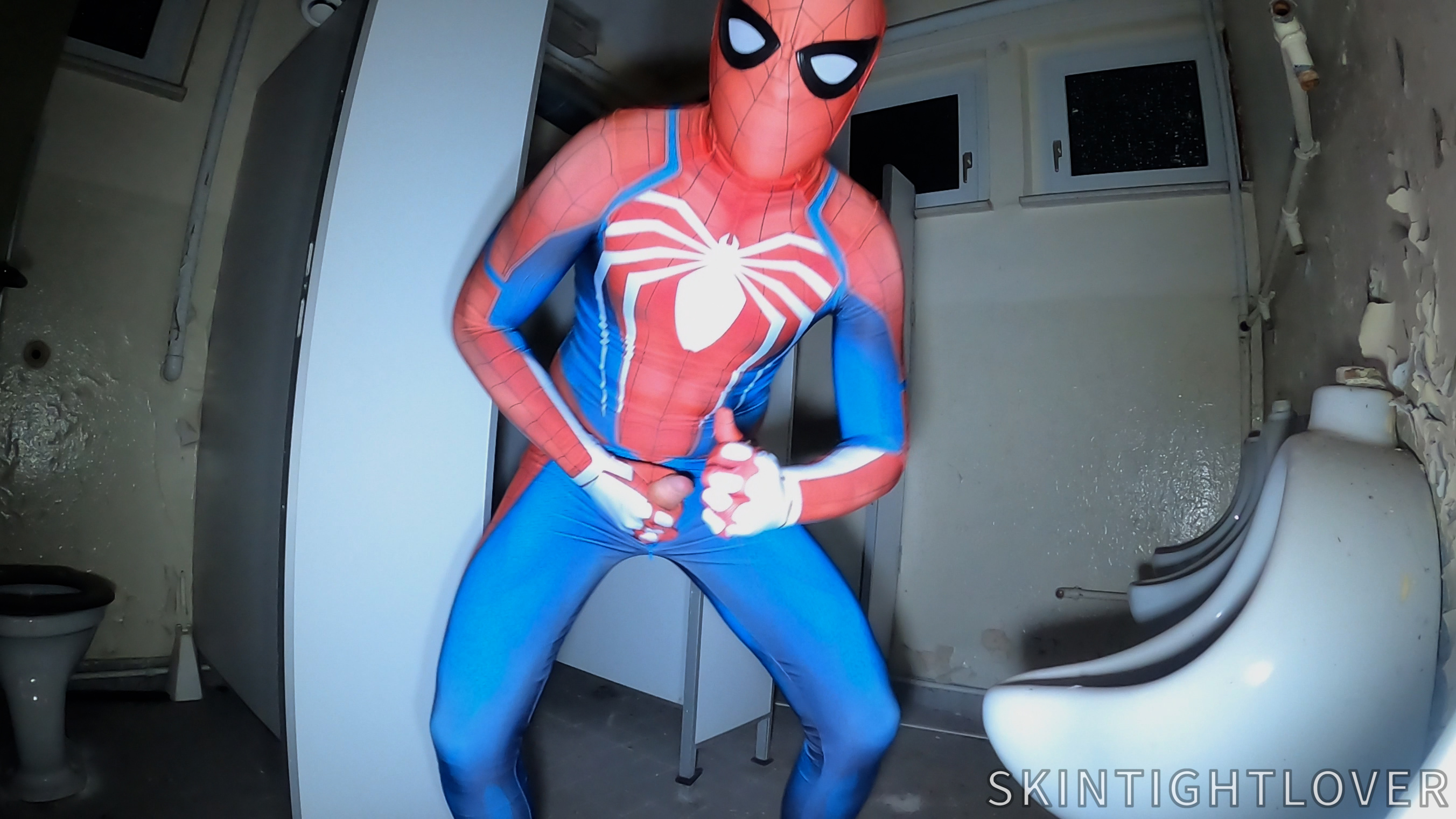 Spiderman shoots web in old building