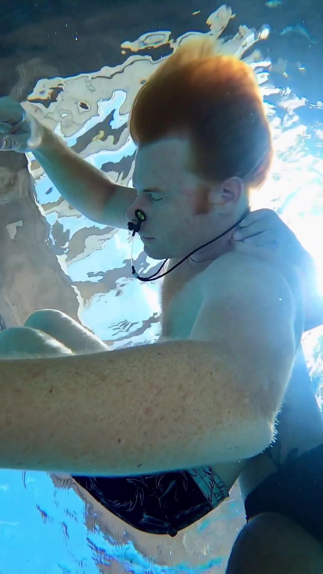 Barefaced redhead breatholding underwater - video 2