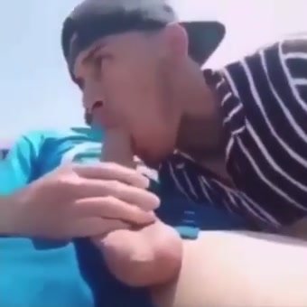 Two Latino friends jerk off at beach