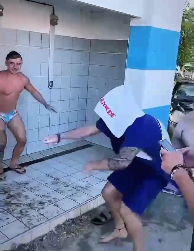 Guy showers naked in public with friends.