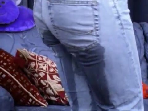 Lady pissing in her jeans inside