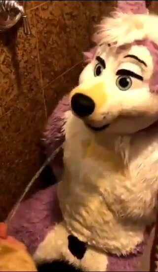 Fursuiter in the tub gets a shower