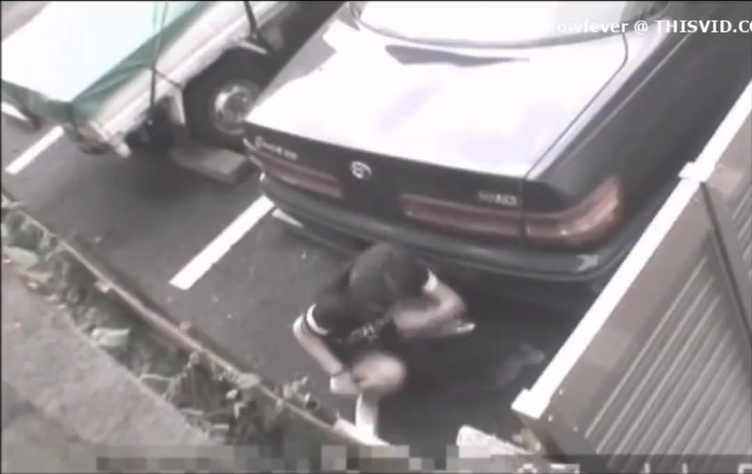 Cctv from 90s catches girl pissing behind a car