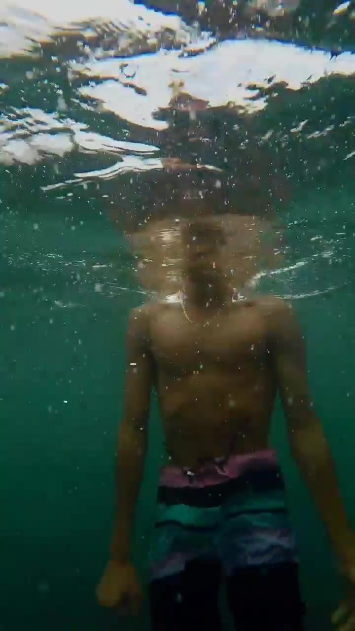 Arab guy goes barefaced underwater