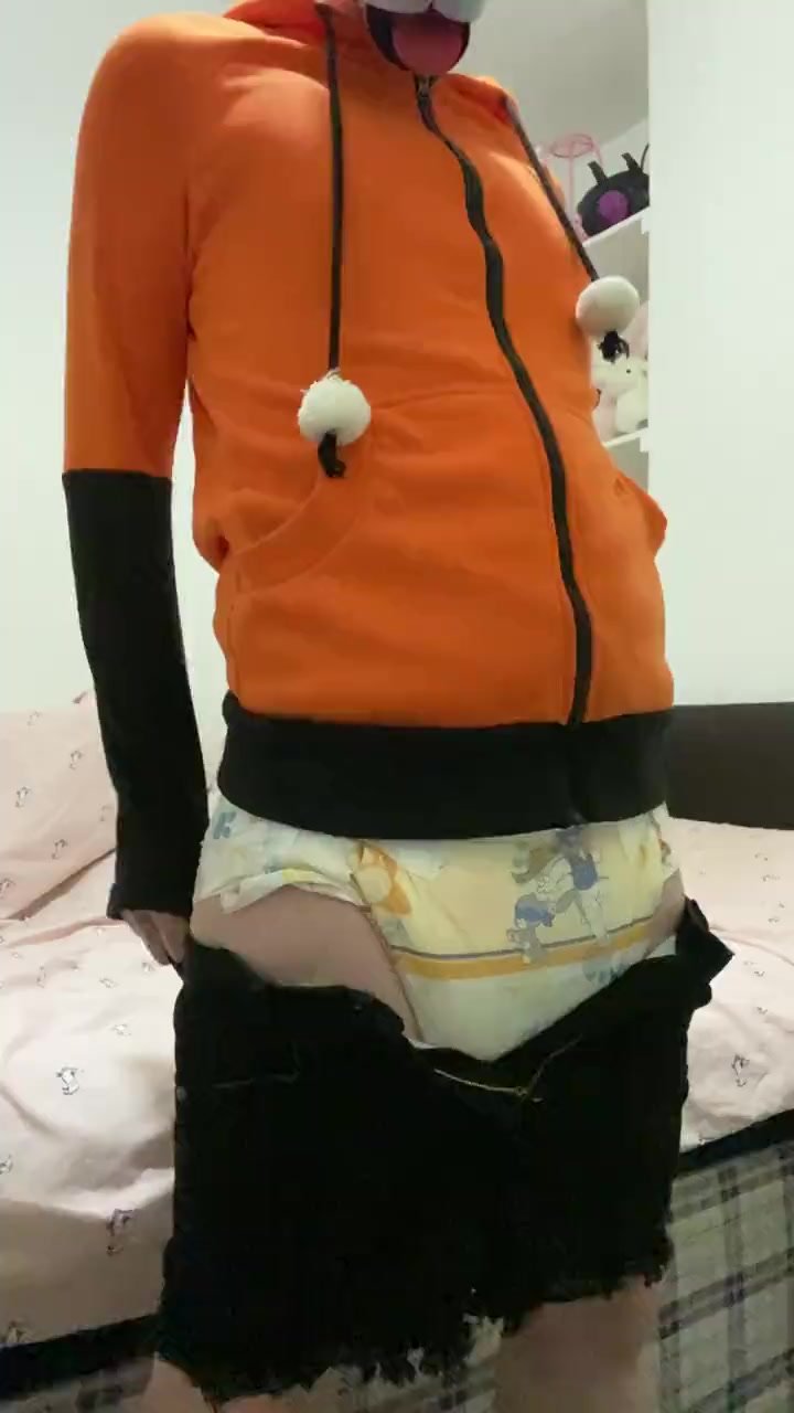 Puppy tries to pull pants over his diaper