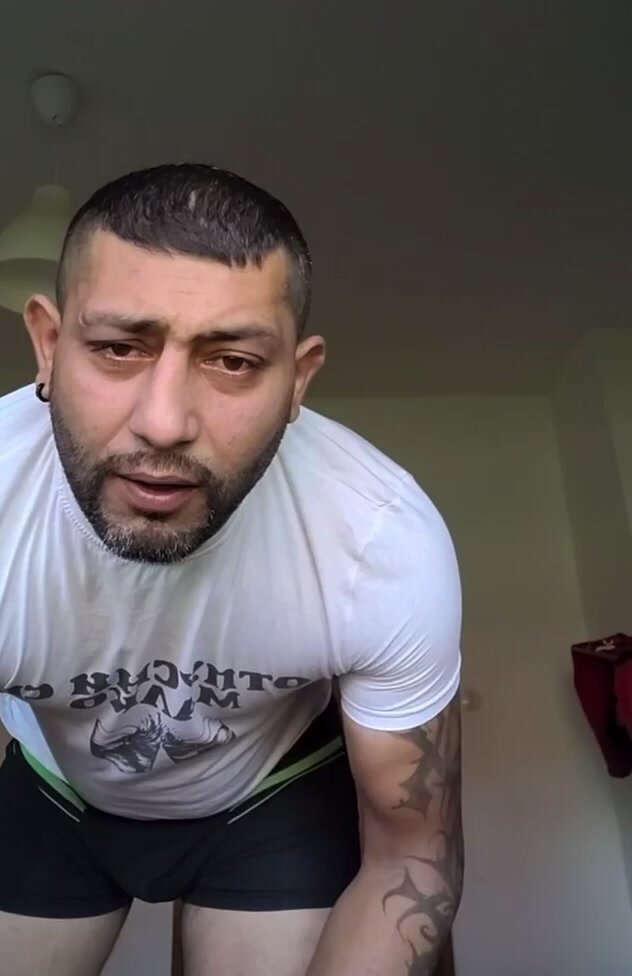 Bulgarian Turkish man getting dressed after shower