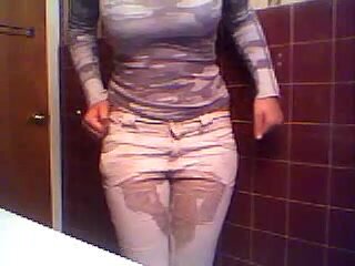 Girl wets her white pants