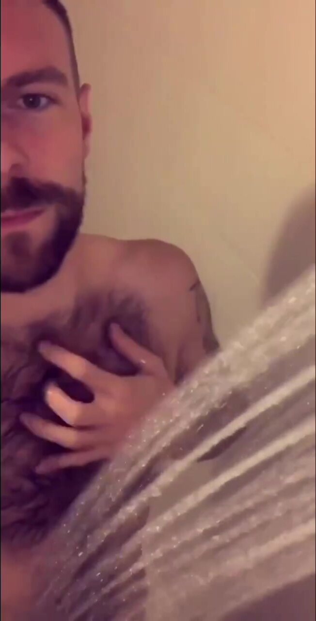 Hairy guy taking a shower