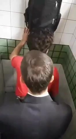 Suited man fucking in the stall