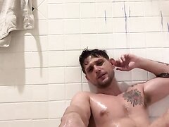 Naked jock in tub