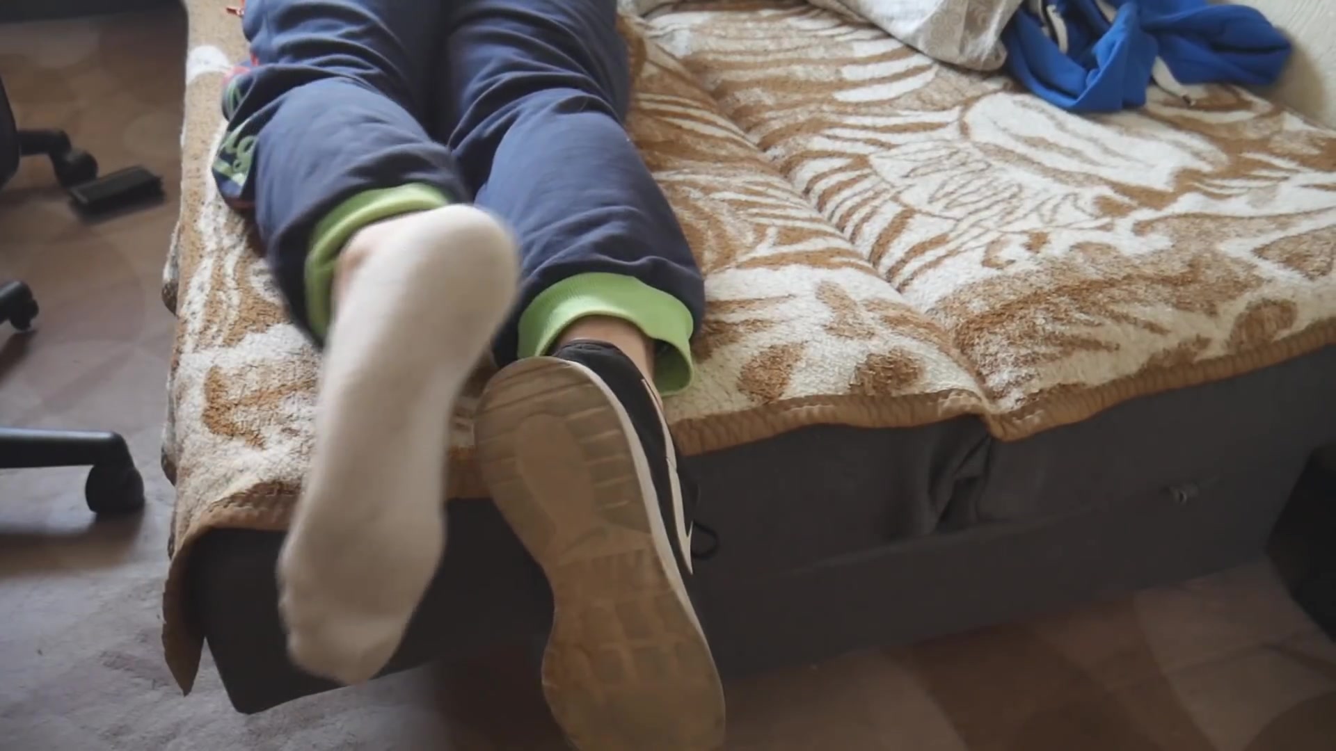 Massaging Ethan's feet in his white Nike ankle socks