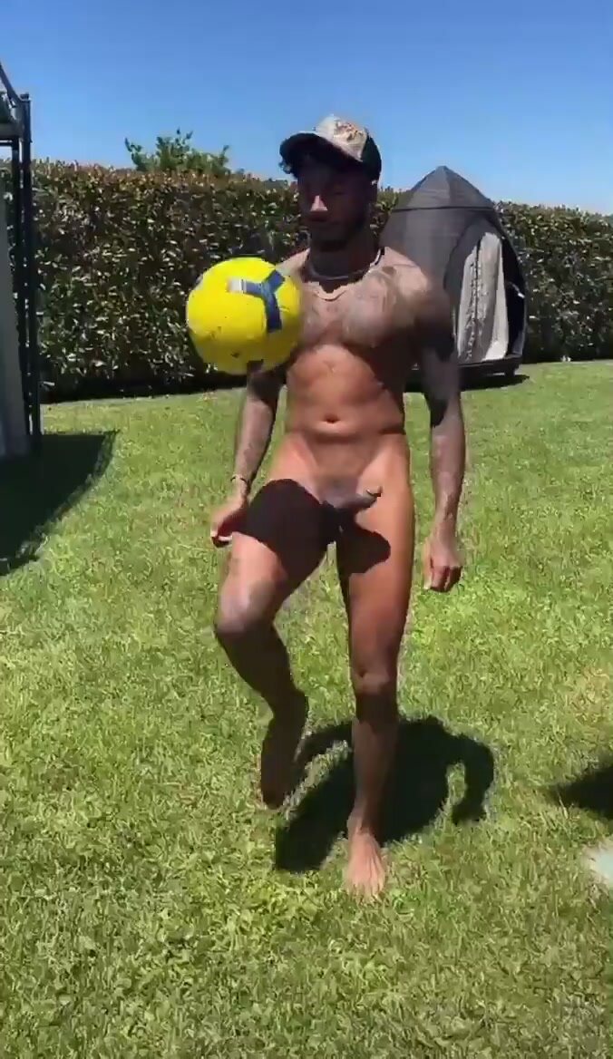 playing with a ball and a boner in his backyard