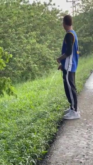 pissing next to a road