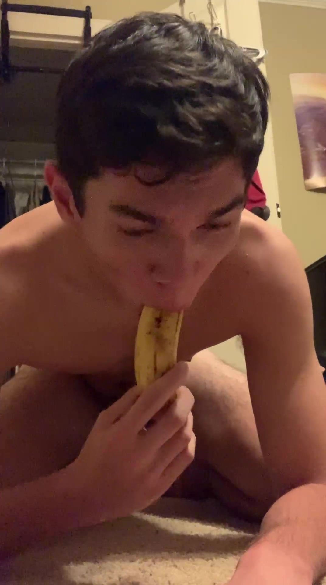 sucking on a banana and shoving it up his ass