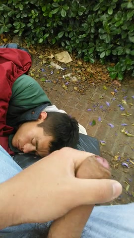 Big cumming on  a sleep homeless face in park
