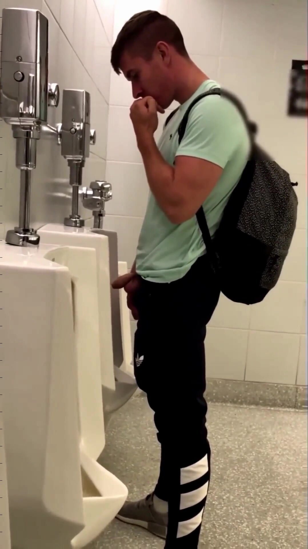 uncut dick and balls out, pissing at urinal