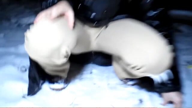 Girl peeing her Winterpants in the Snow