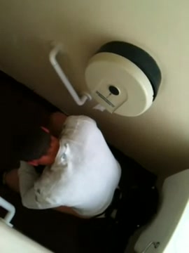 A guy pooping extremely hard.