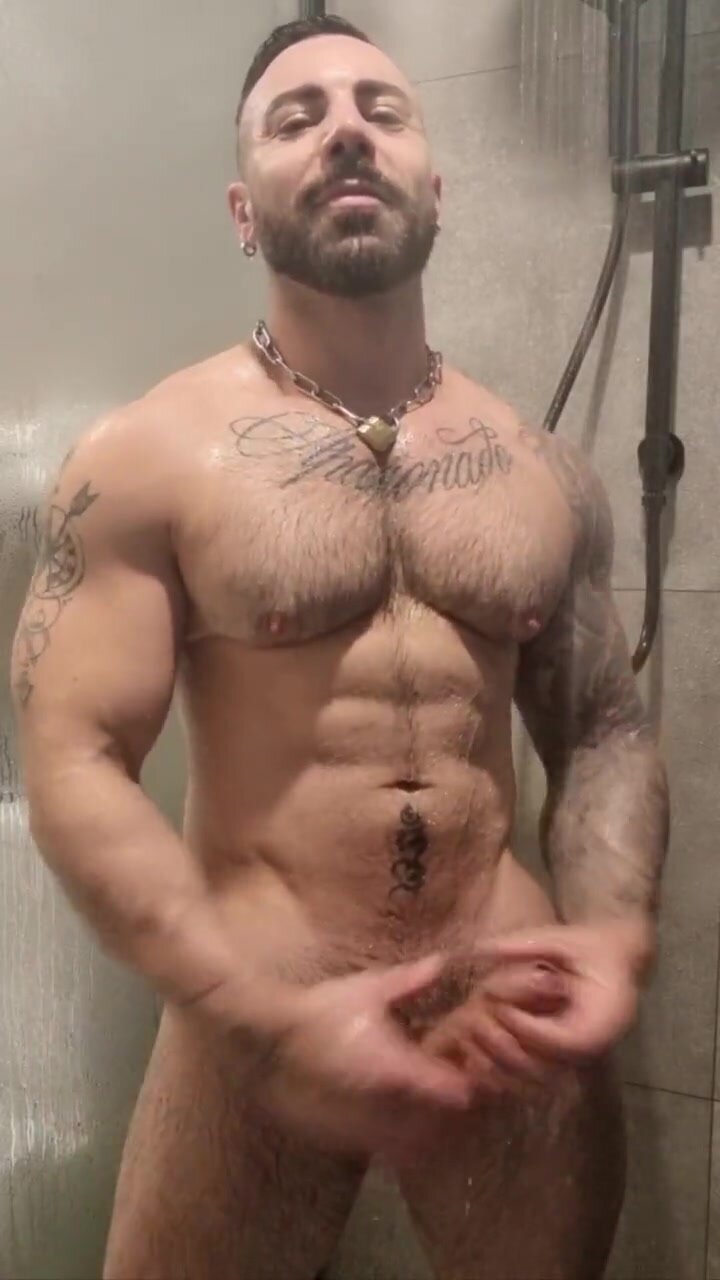Tattooed muscle man jerking off in the shower