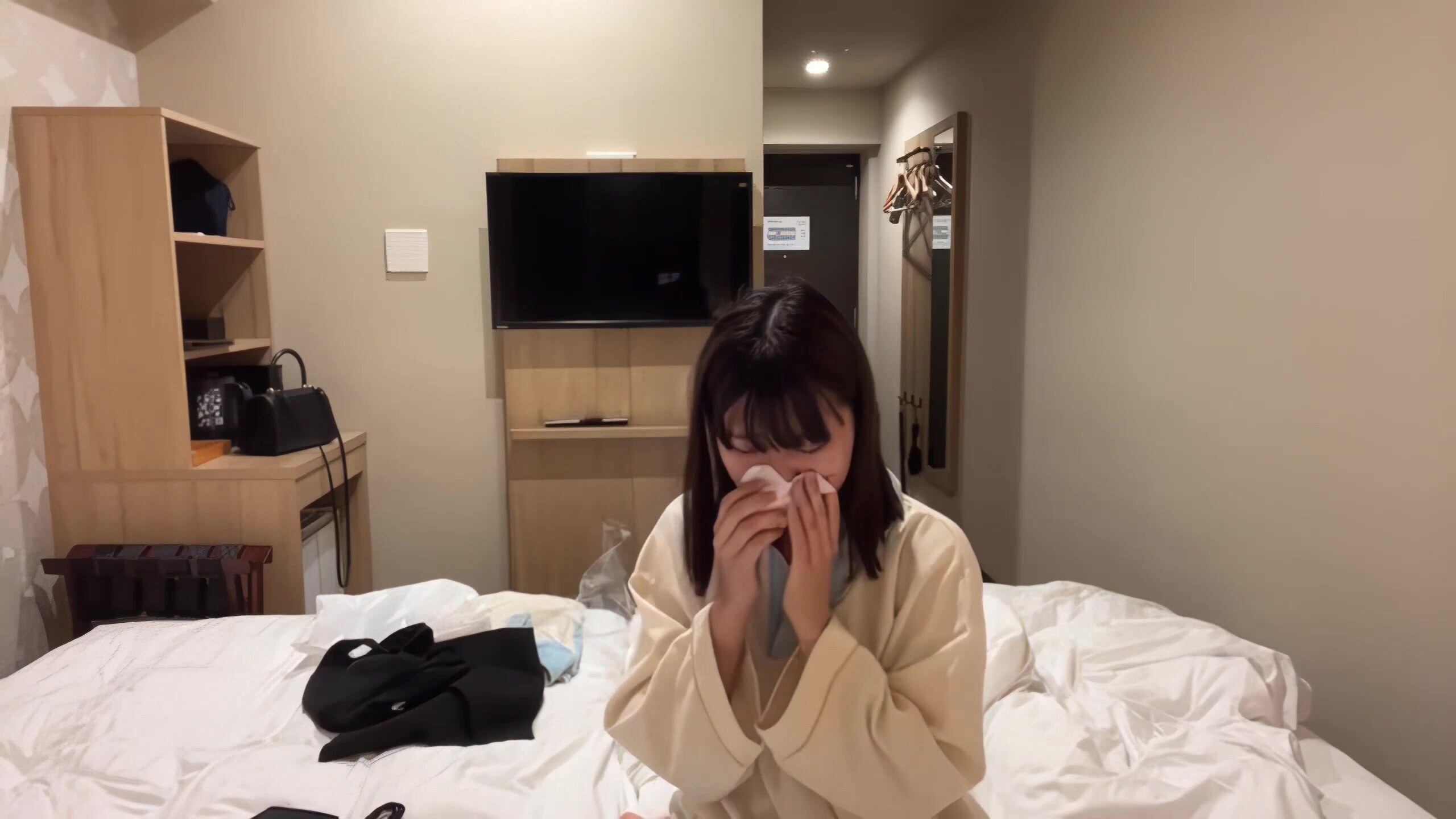 More nose blows and a sneeze from cute Asian girl