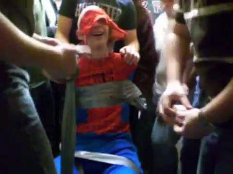 Spider-Man taped to chair in the elevator