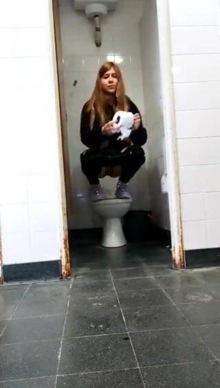 Dirty blonde makes a piss mess in restroom