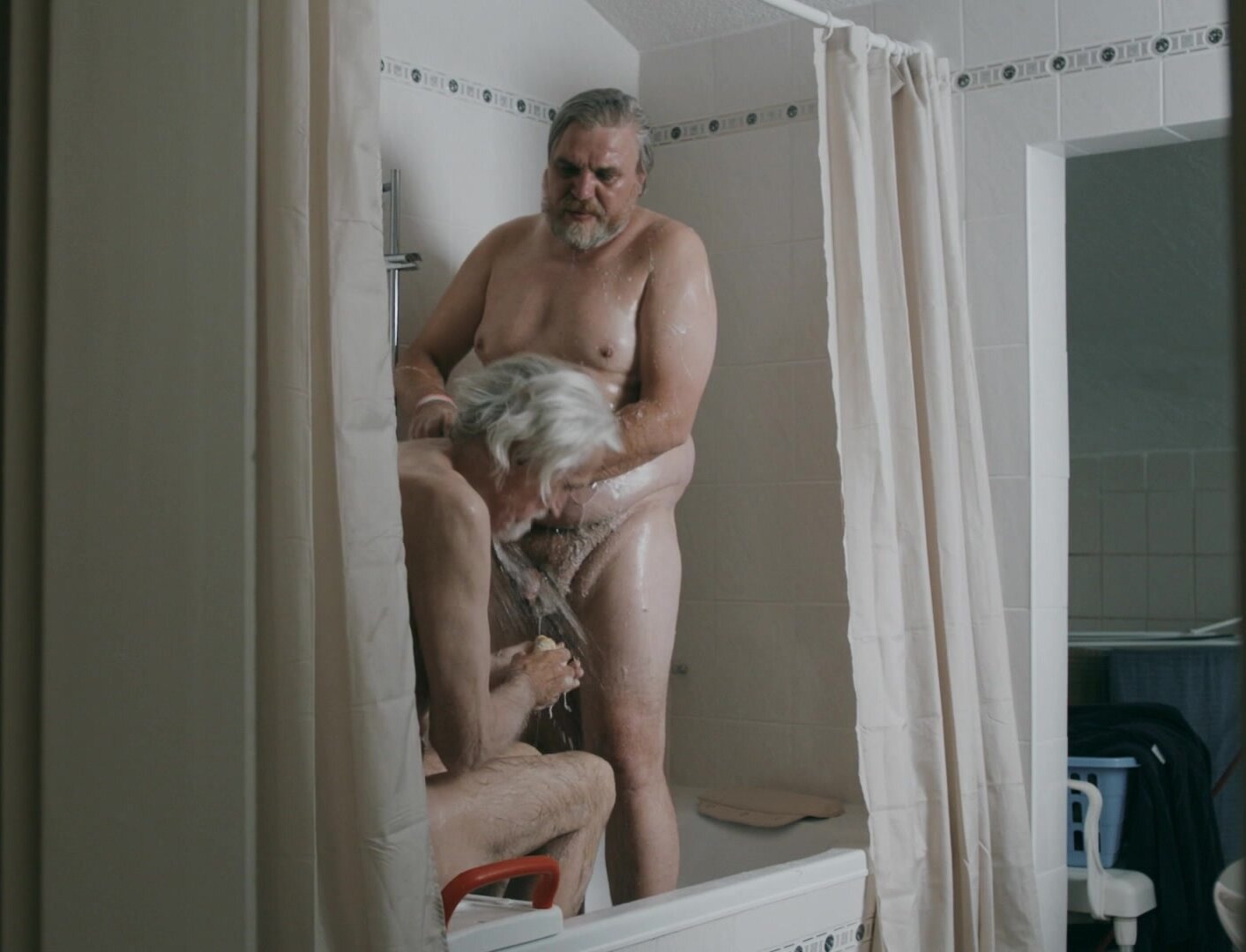 Big guy taking shower along with his RL dad in film