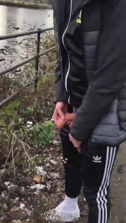 showing off his uncut dick pissing outdoors