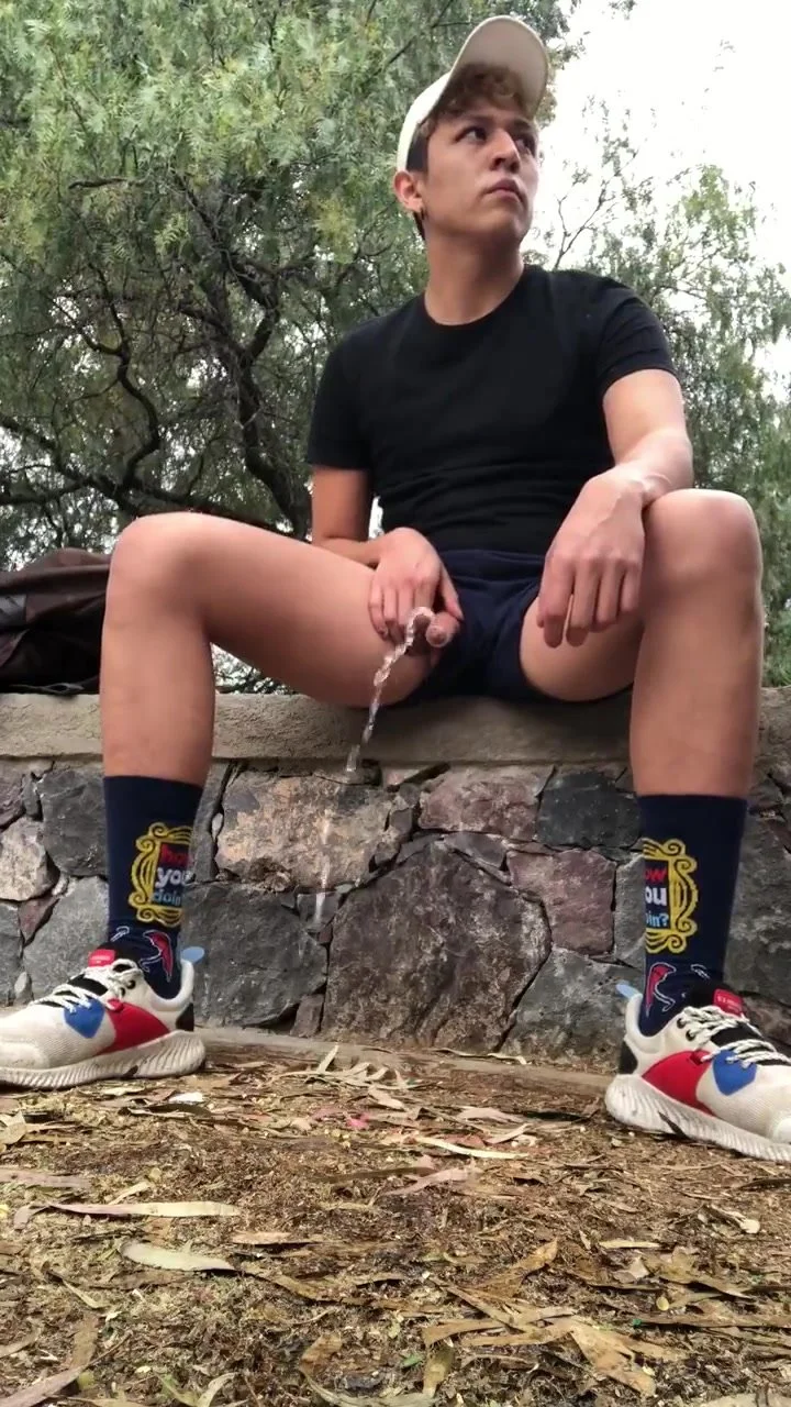 Pissing with his dick ... out of his shorts - ThisVid.com