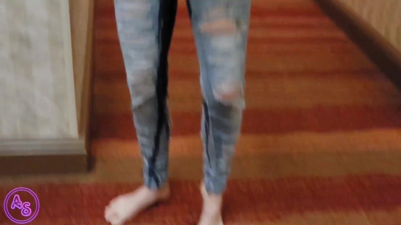 Pees Down Legs in Jeans in Hotel Hallway