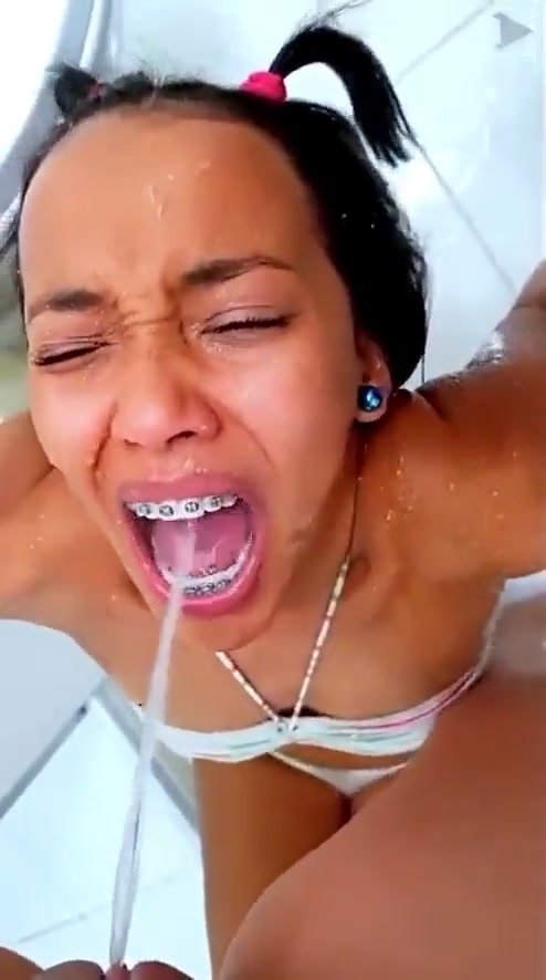 Cute Brazilian girl with braces takes anothers piss
