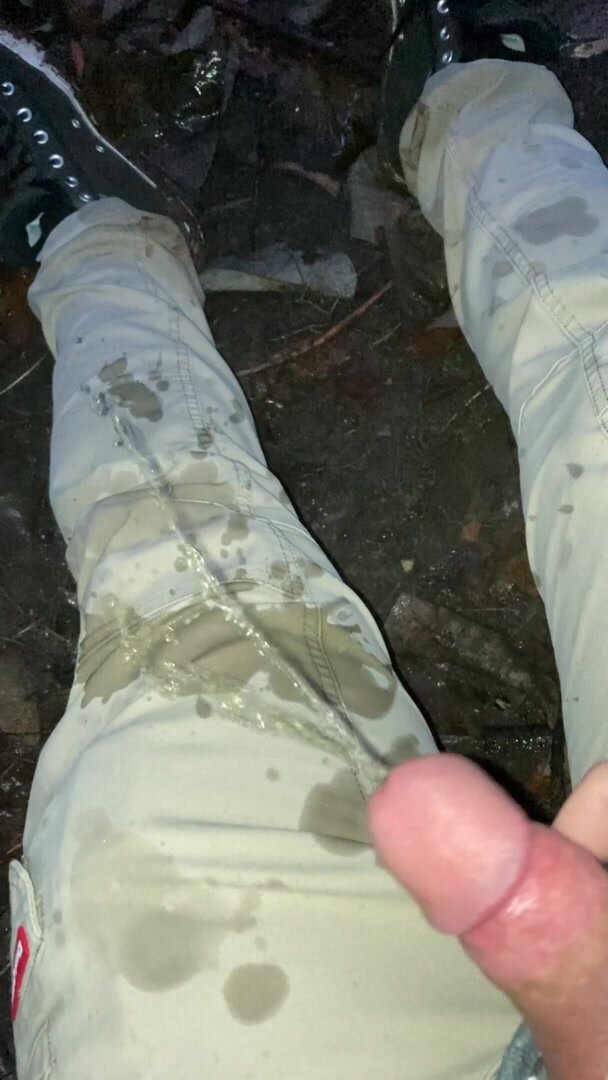 Young guy pissing on his pants