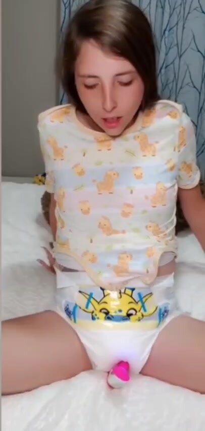 Little teen in diaper rides her favorite plushie