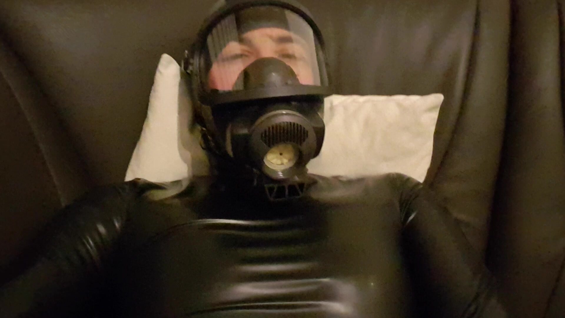Latexboy enjoy chilling on couch