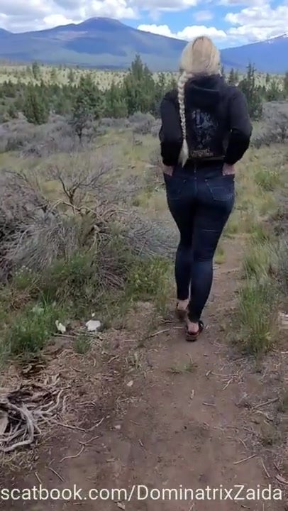 Sexy ass blonde pisses in a field