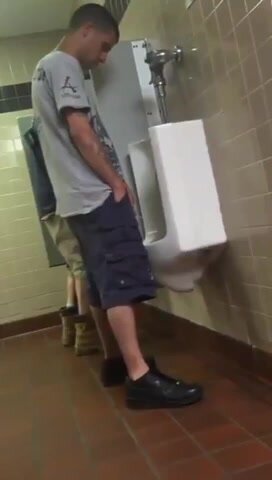 pissing in a public bathroom