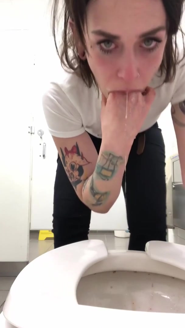 Sexy Skinny Girl gags herself to puke in toilet