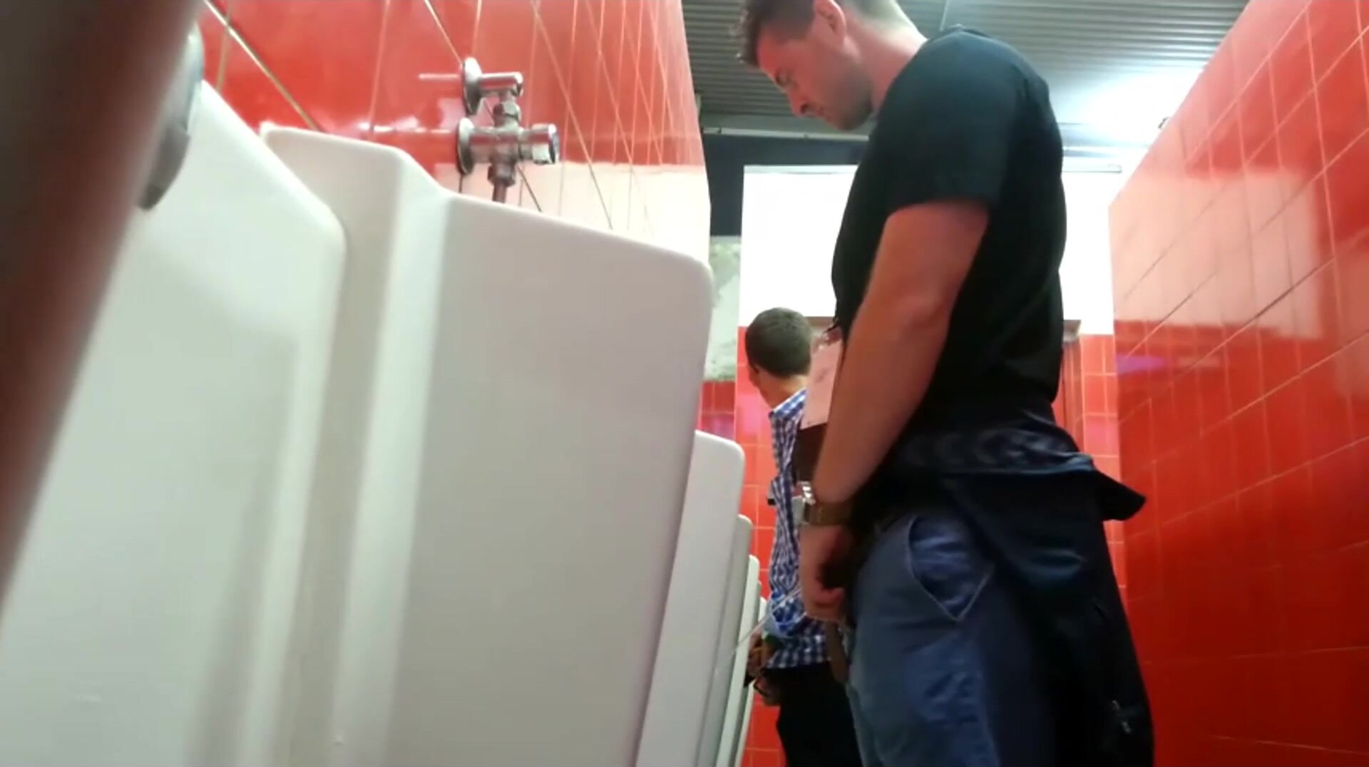 small dicked guy taking a peek a bigger dick at urinal