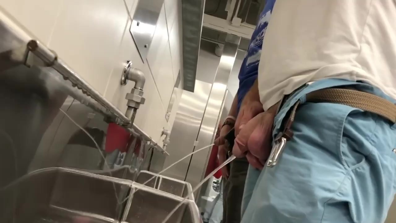 cut dick pissing in urinal with balls out