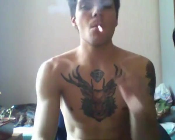 Tattooed hot guy wanks, spunks and smokes on cam