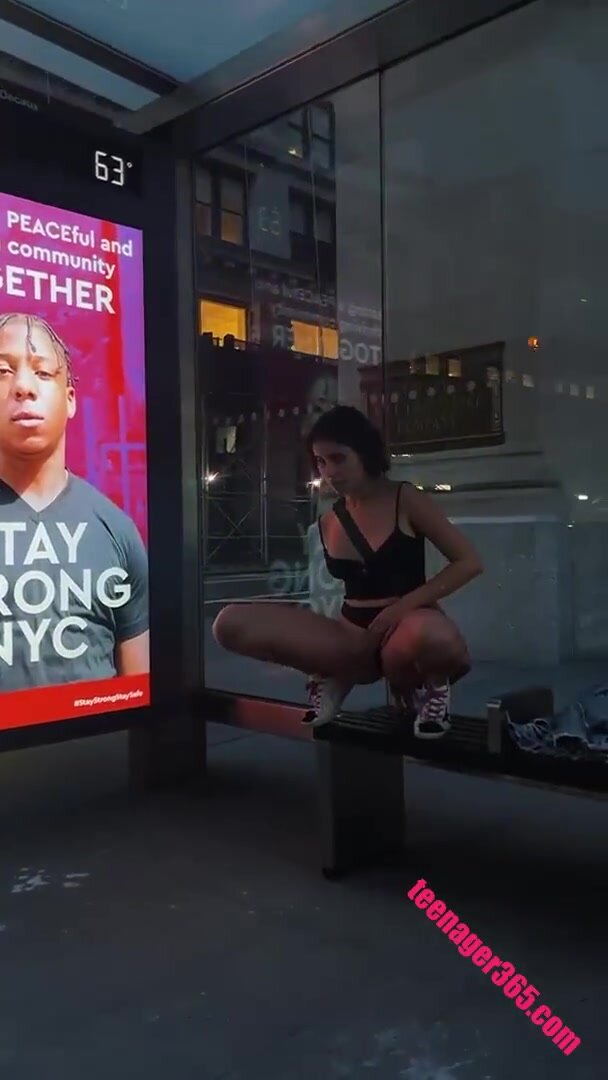 Girl pees at NYC bus stop
