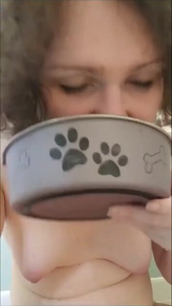Girl eats shit from a dog bowl and gags