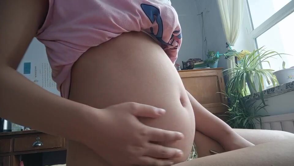 big belly girl play with belly button