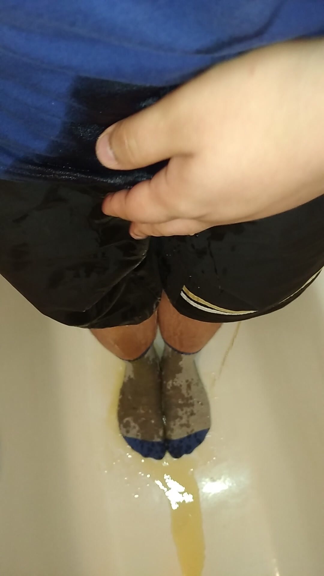 Wetting my black shorts and grey socks