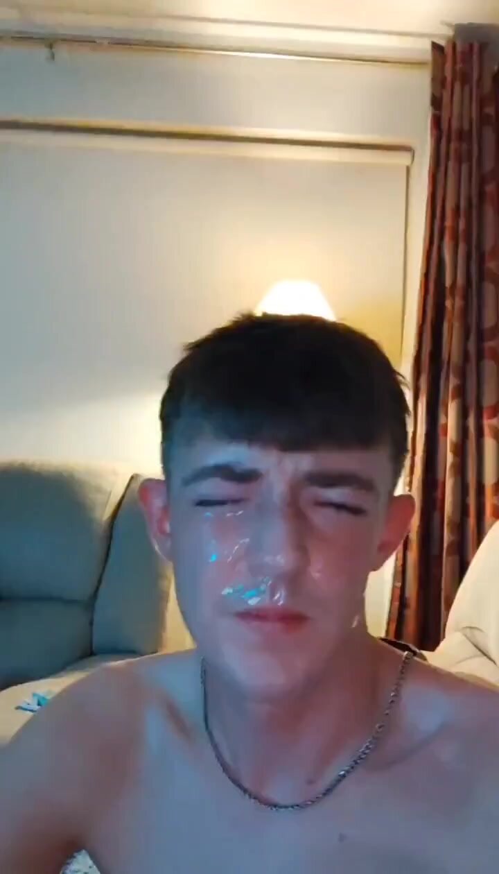 covering his own face in his cum