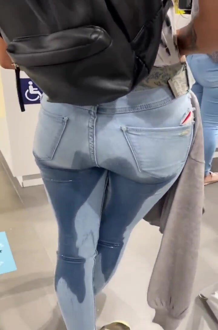 Girl Wetting Her Jeans Inside Clothing Store